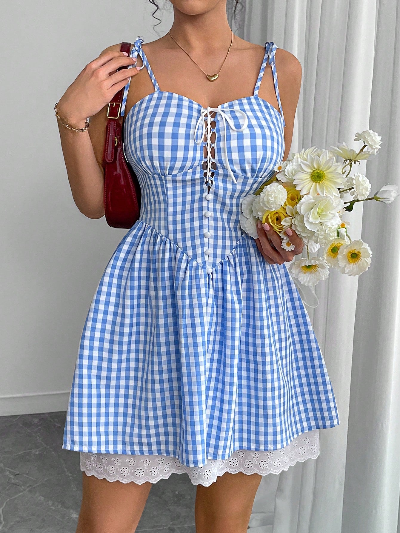 Effortlessly elevate your style with our Chic Plaid Mini Slip Dress. Featuring a trendy plaid print and a playful tie-up detail, this dress adds a touch of quirkiness to any outfit. Perfect for a fun and stylish look, this dress is a must-have for any fashion-forward individual.