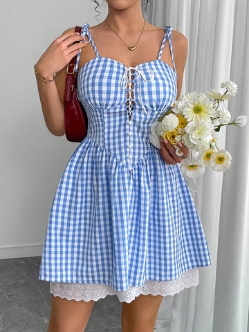 Effortlessly elevate your style with our Chic Plaid Mini Slip Dress. Featuring a trendy plaid print and a playful tie-up detail, this dress adds a touch of quirkiness to any outfit. Perfect for a fun and stylish look, this dress is a must-have for any fashion-forward individual.