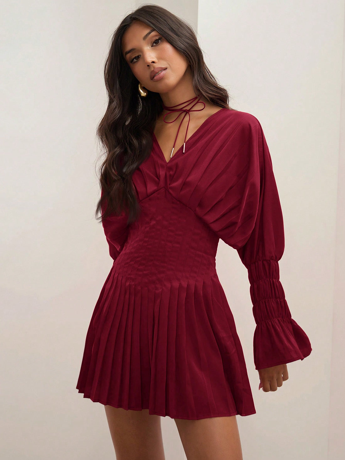 Elevate your fall wardrobe with our Chic Pleated Mini Dress! Featuring an elegant red v-neck and long sleeves, this dress is both stylish and comfortable. The pleats add a touch of sophistication while the mini length makes it perfect for any occasion. Embrace your inner fashionista and stand out in this must-have outfit!