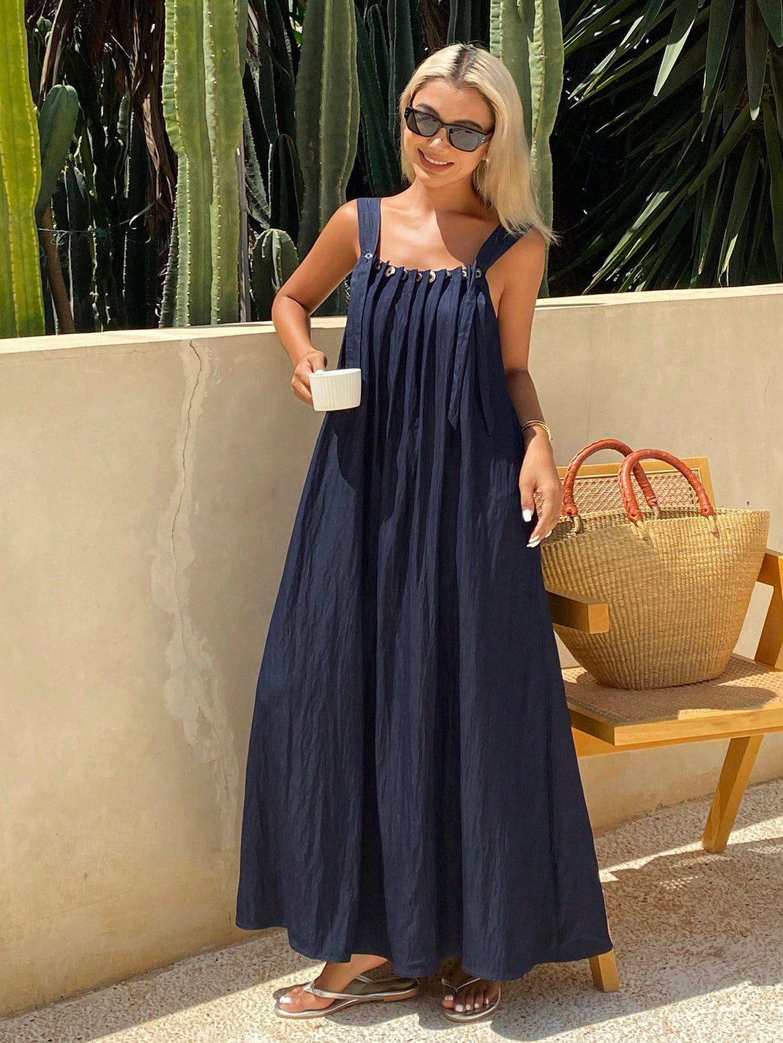 Step into sunny days with this chic pleated sleeveless dress, designed to keep you cool and stylish all spring and summer long. Its flowing pleats add a fun, flirty vibe, while the solid colors make it easy to mix and match with your favorite accessories. Perfect for brunch dates, beach strolls, or garden parties, this dress brings effortless charm to your warm-weather wardrobe.
