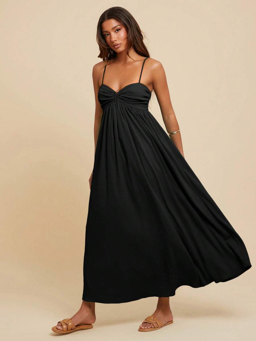 Capture the essence of a perfect summer getaway in a dress designed for movement, comfort, and undeniable style. This pleated masterpiece is the ultimate companion for sun-drenched boardwalks and sandy shores, offering a lightweight silhouette that feels as free as a sea breeze.