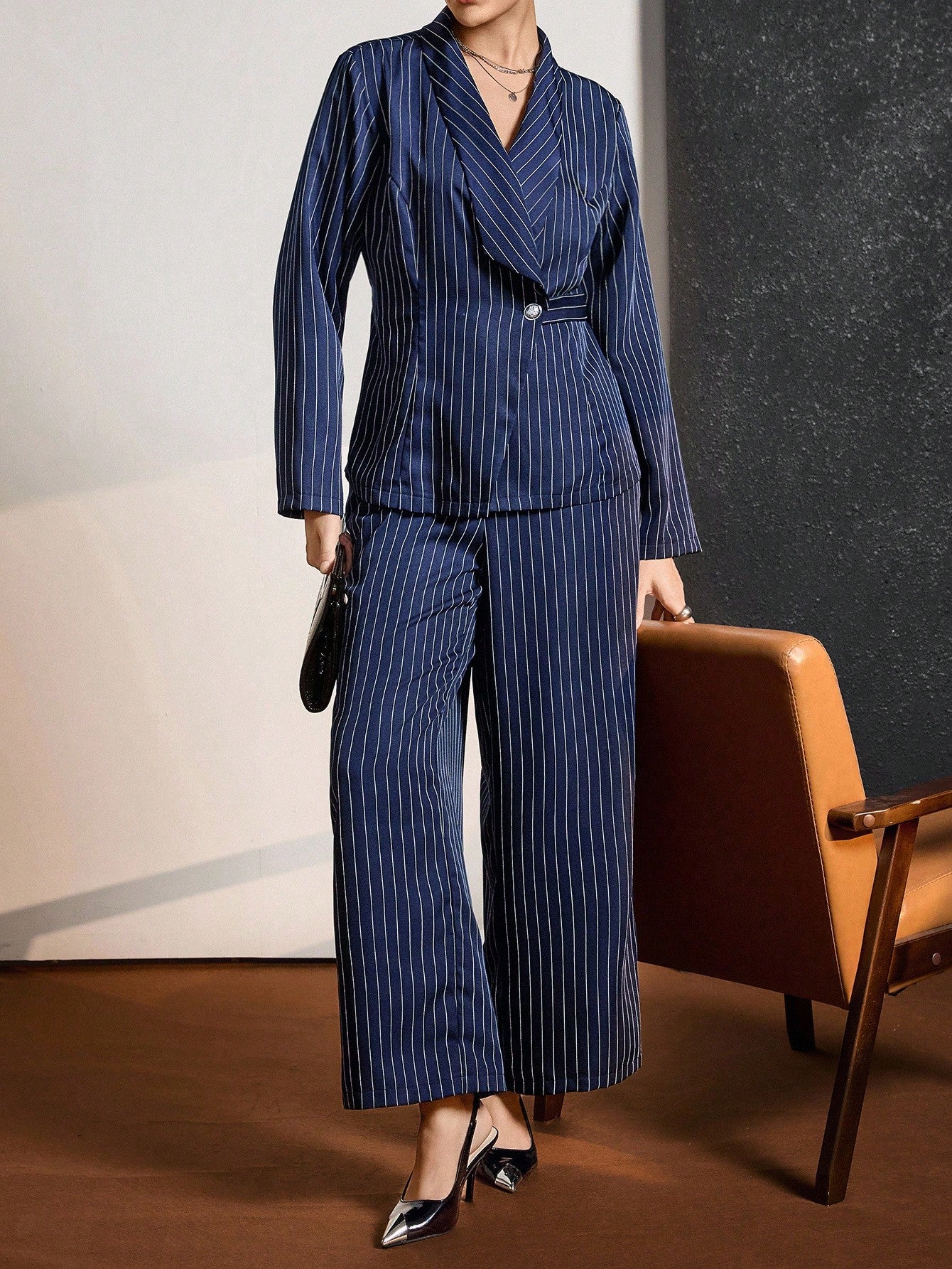 Elevate your work wardrobe with this stunning plus-size blazer set that's equal parts polished and fun! The crisp blue and white stripes bring timeless sophistication while the tailored fit flatters your frame beautifully. Perfect for boardroom meetings, client lunches, or anywhere you want to command attention, this set transitions seamlessly from fall into winter. Mix and match the pieces for endless styling possibilities—dress it up with heels or keep it casual with your favorite sneakers. Because lookin