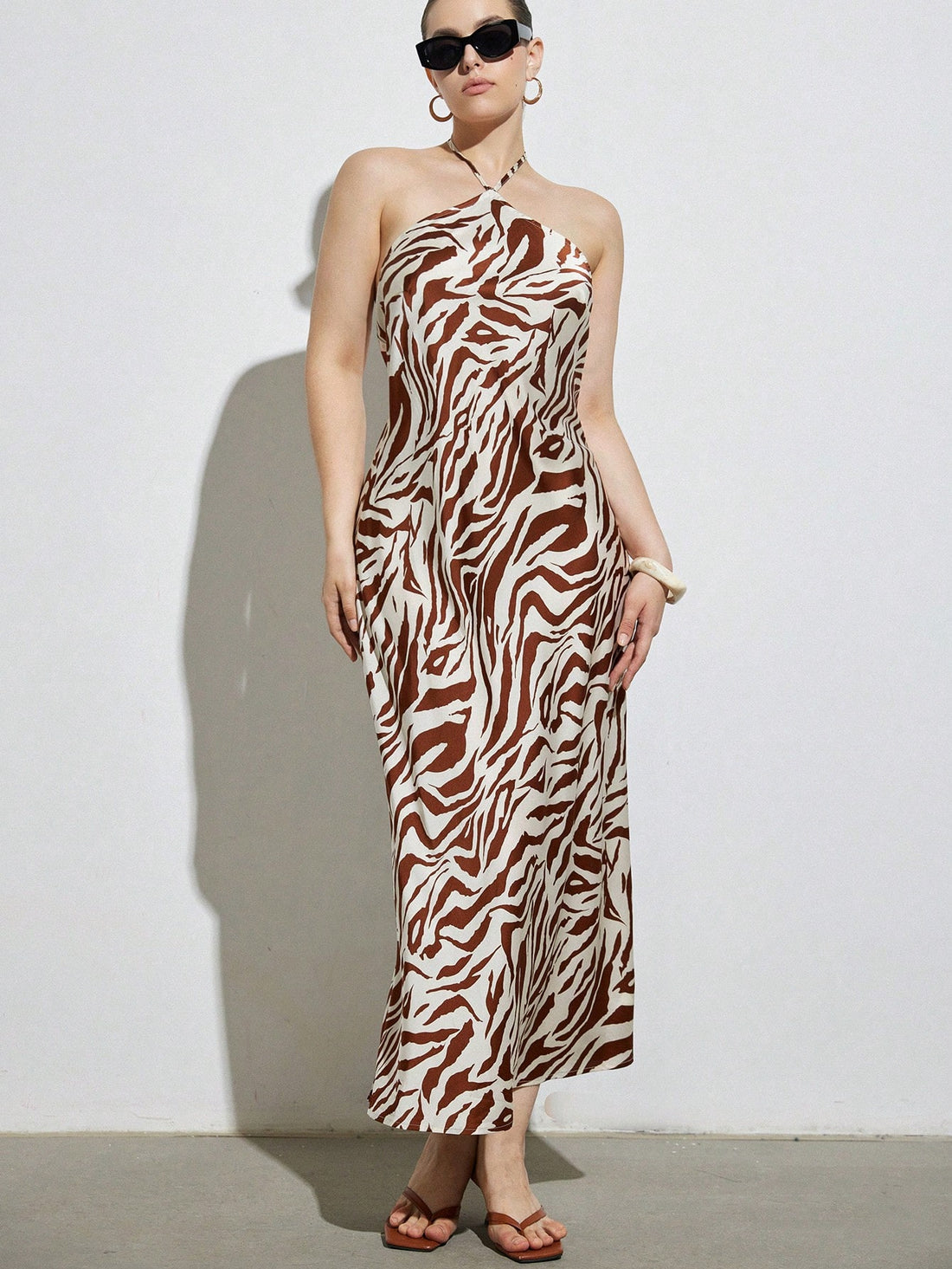 Step into effortless style with this chic plus-size maxi dress featuring a bold colorblock zebra print. Perfect for casual holiday outings, its flowing silhouette offers comfort while making a striking statement. Embrace playful patterns and vibrant contrasts that celebrate your curves with confidence and flair.