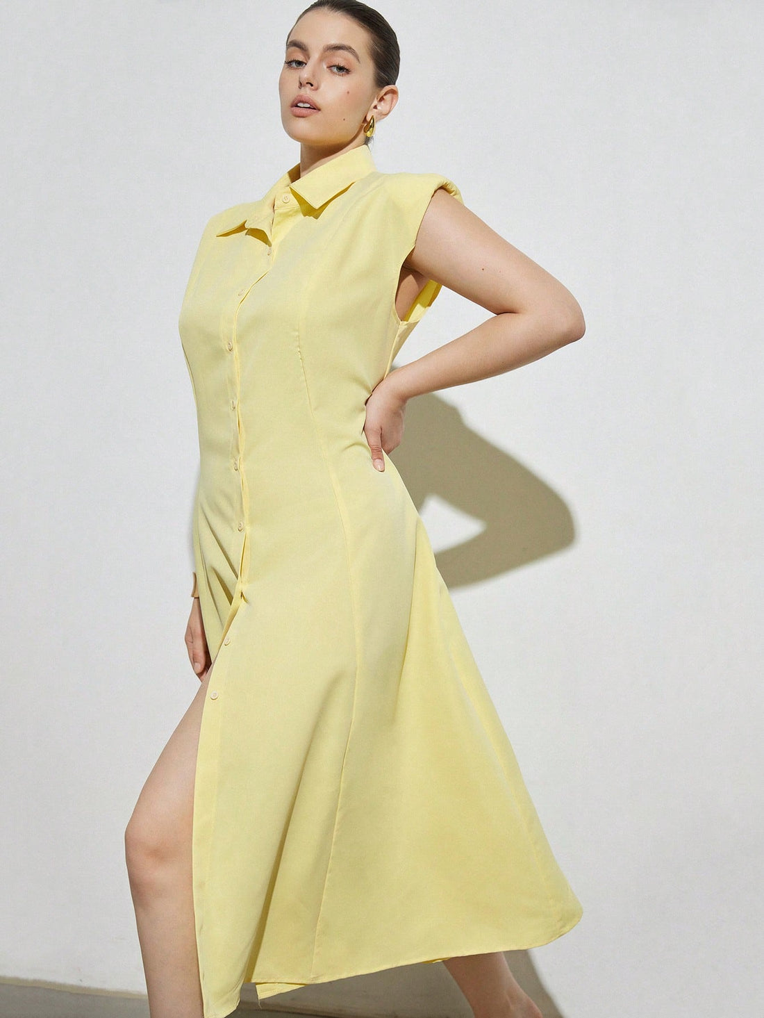 Brighten your summer wardrobe with this chic plus-size pale yellow sleeveless A-line dress. Featuring stylish shoulder pads, it adds a fun, structured flair while keeping you cool and comfortable. Perfect for sunny days and playful outings, this dress combines flattering shape with effortless charm.