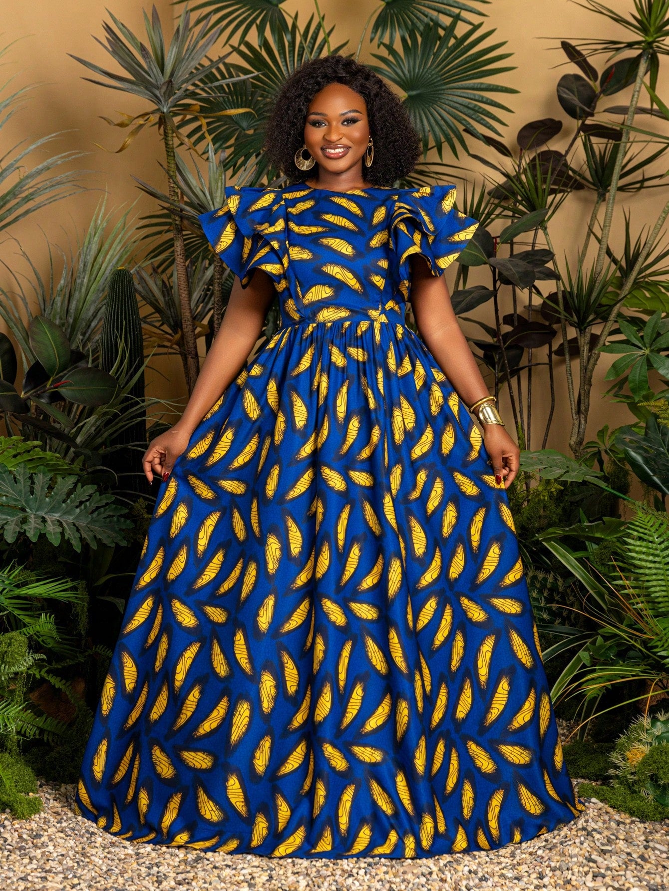 Make a vibrant statement this summer with our Chic Plus Size African Print Maxi Dress. Featuring playful ruffled sleeves and a flowing silhouette, this dress blends comfort and style effortlessly. Perfect for beach parties or any festive event, its bold prints and breezy fit will keep you cool and confident all day long. Dance through warm evenings in eye-catching elegance!
