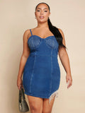 Turn heads with this playful plus size denim dress featuring a sparkling rhinestone fringe hem that adds just the right amount of glam. The strappy design keeps it flirty and fun, perfect for dancing the night away or making a statement at your next outing. Comfortable and stylish, this dress celebrates your curves with confidence and charm.