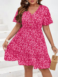 Be the talk of the town with this Chic Plus Size Ditsy Floral Ruffle Hem Summer Dress. Stay cool, comfortable and stylish all summer long with its flattering ruffle hem and charming ditsy floral print. Don't miss out on this must-have addition to your wardrobe!
