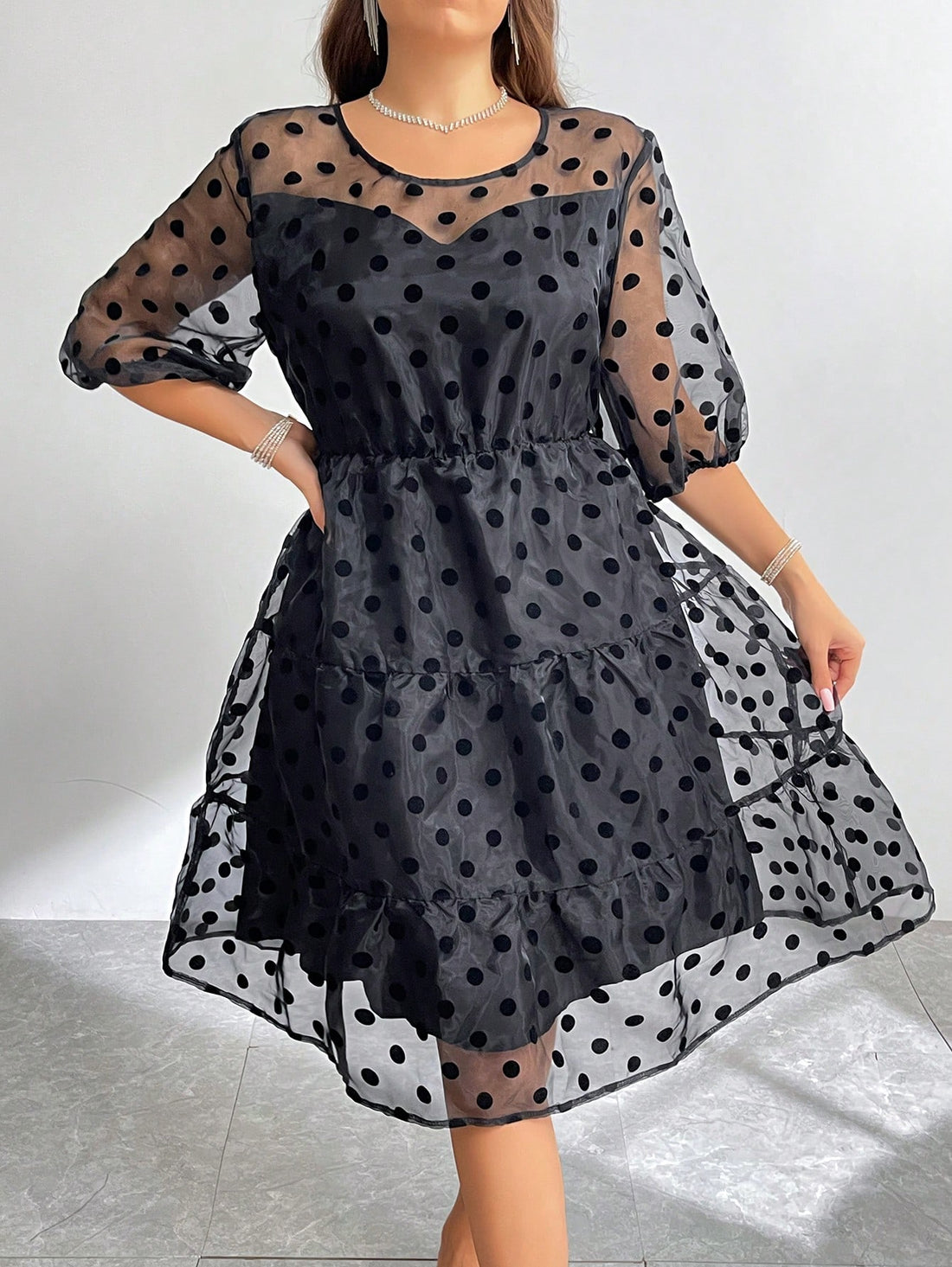 Step out with playful charm in this Chic Plus Size Flocked Polka Dot A-Line Mesh Dress. Its soft, sheer mesh and bold polka dots create a fun yet flattering silhouette that moves with you. The A-line cut offers comfortable ease, making it perfect for day-to-night wear with effortless style.