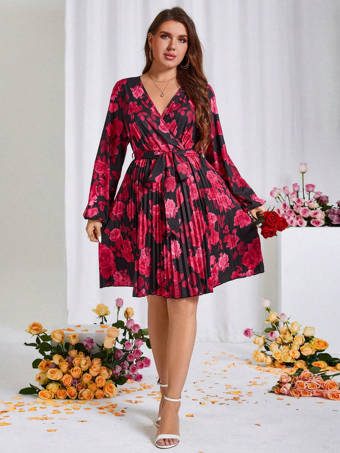 Get ready to turn heads in this Chic Plus Size Floral Pleated Dress! With a flattering belted waist and beautiful floral print, this dress is perfect for the spring season and even doubles as a great Valentine's Day outfit. Don't miss out on this must-have addition to your wardrobe.