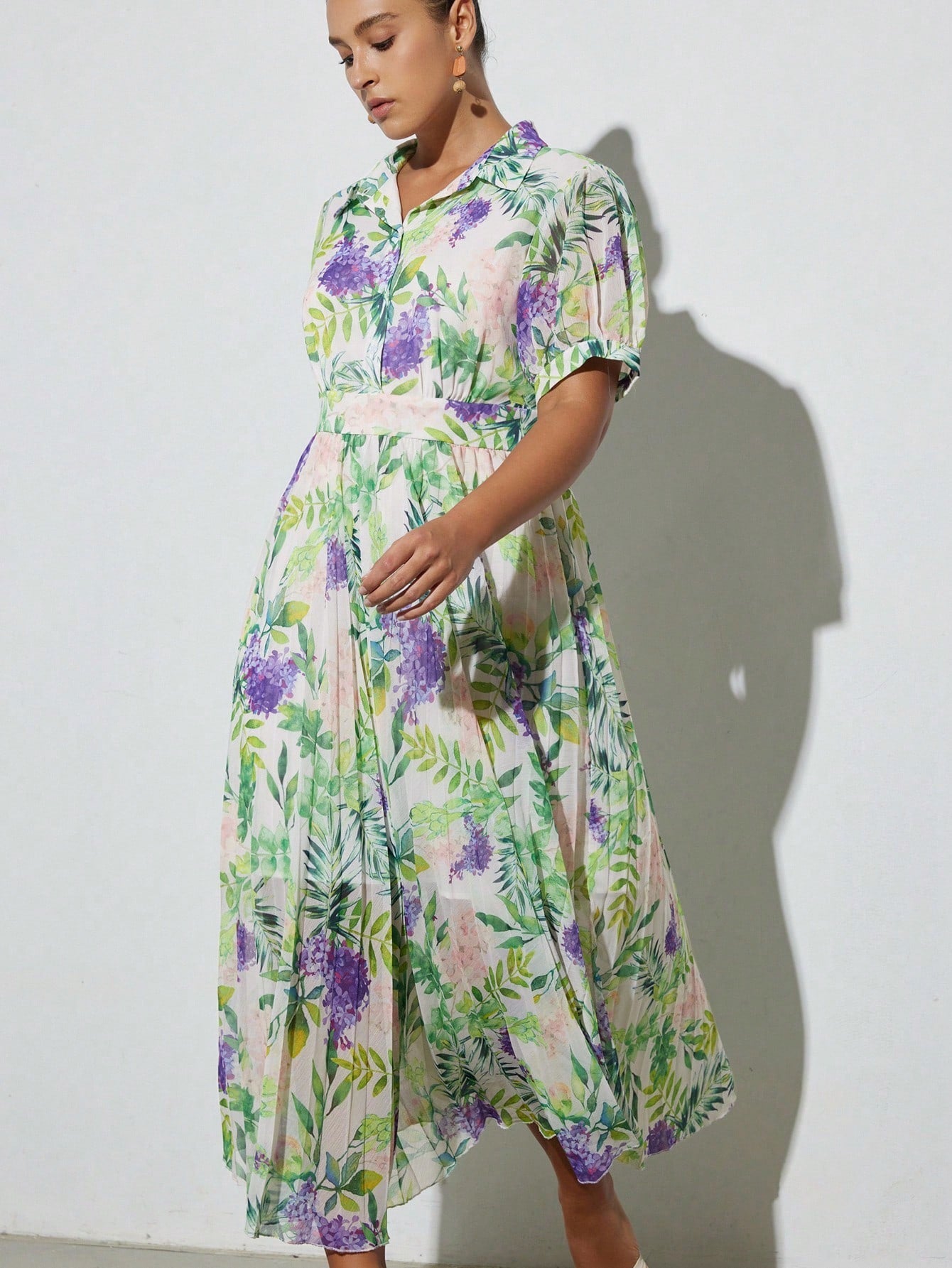 Step into spring and summer with this playful plus size mini dress, featuring a vibrant floral print that brightens any day. The puff sleeves add a touch of whimsy, while the ruffle hem brings flirty movement to your look. Perfect for sunny outings or casual gatherings, this dress combines comfort and style effortlessly. Embrace your curves and let your fun side bloom!