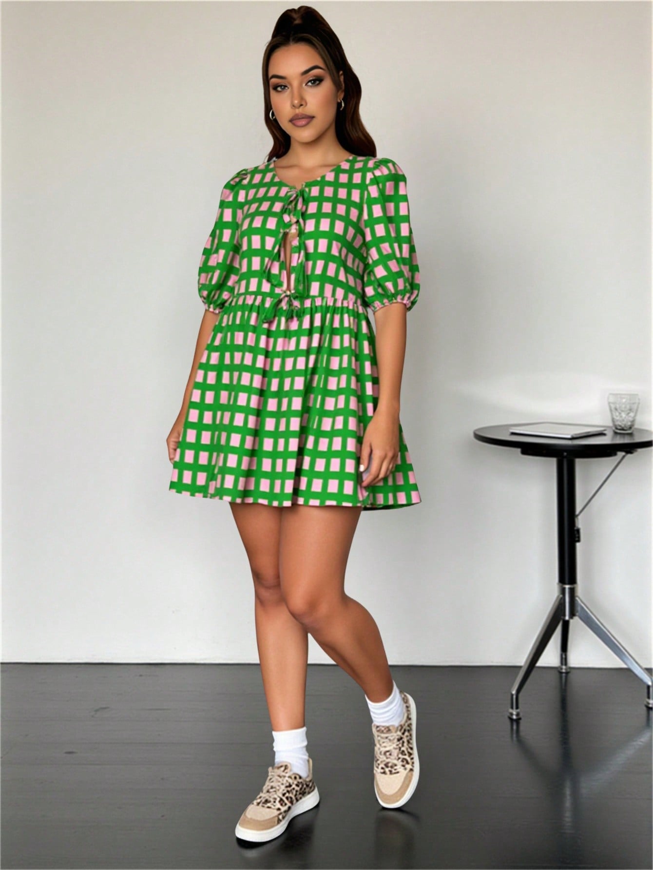 Step out in style with this chic plus size casual dress featuring a bold geometric print that adds a fun twist to your wardrobe. The front tie detail flatters your silhouette, while the lantern sleeves bring a playful, breezy vibe perfect for any occasion. Comfortable and eye-catching, this dress is your go-to for effortless charm and confidence.