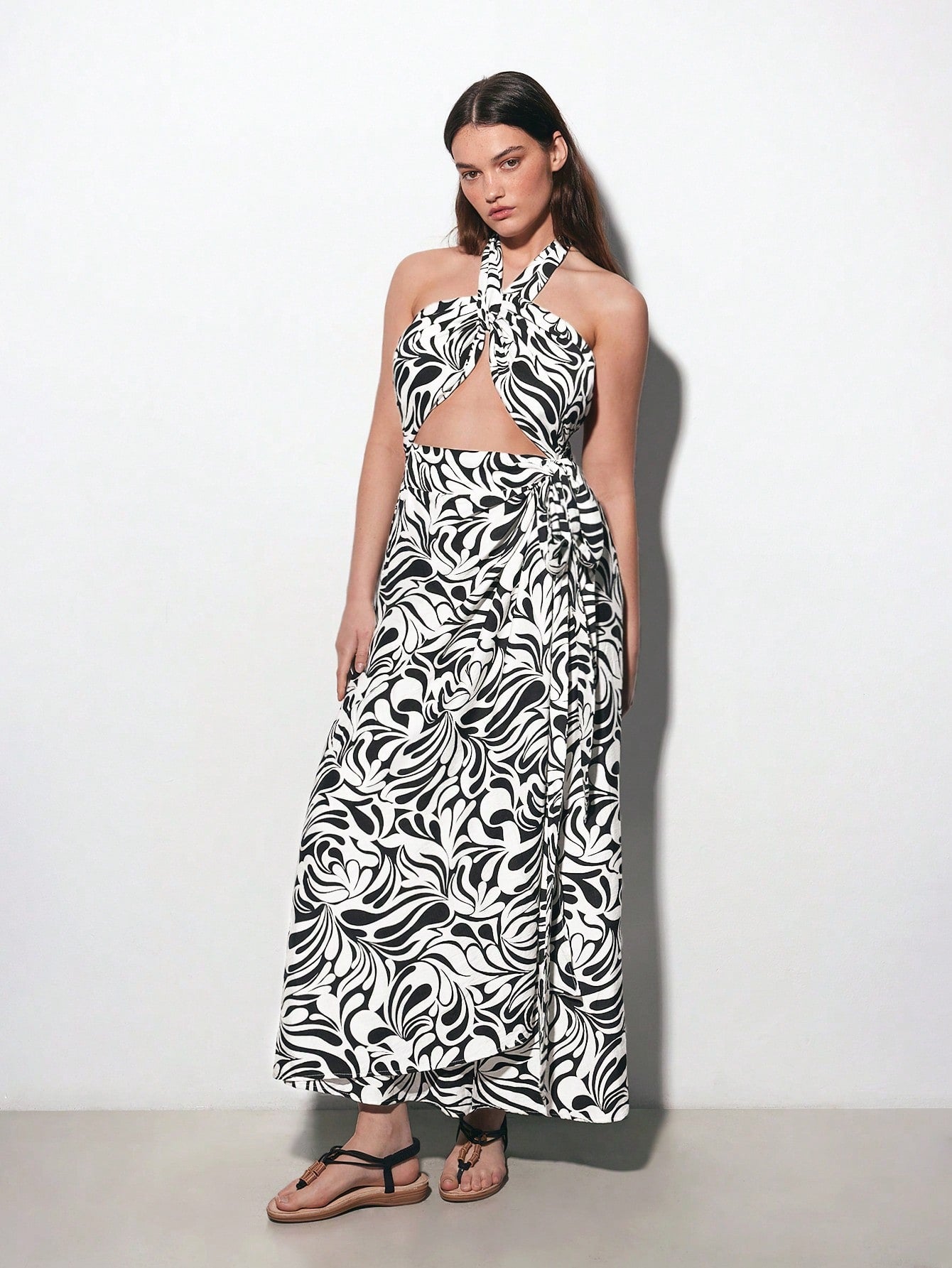 Turn heads at your next country festival in this fabulous halter wrap dress! Designed for curves and confidence, this chic piece features a retro bohemian print that captures free-spirited vibes with timeless flair. The flattering wrap silhouette cinches at the waist while the halter neckline offers adjustable support and a touch of flirty elegance. Perfect for outdoor celebrations, music events, or any occasion calling for boho-inspired style. Slip it on and let your personality shine as bright as the dese