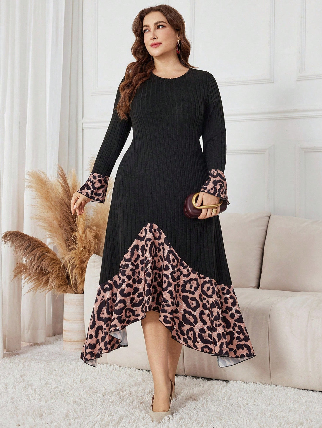 Turn heads in this playful plus size dress featuring a bold leopard print and an eye-catching asymmetrical hem. Crafted with a soft knitted and brushed patchwork design, it offers both comfort and style for any occasion. Flowy yet flattering, this dress lets you embrace your wild side with ease and confidence.