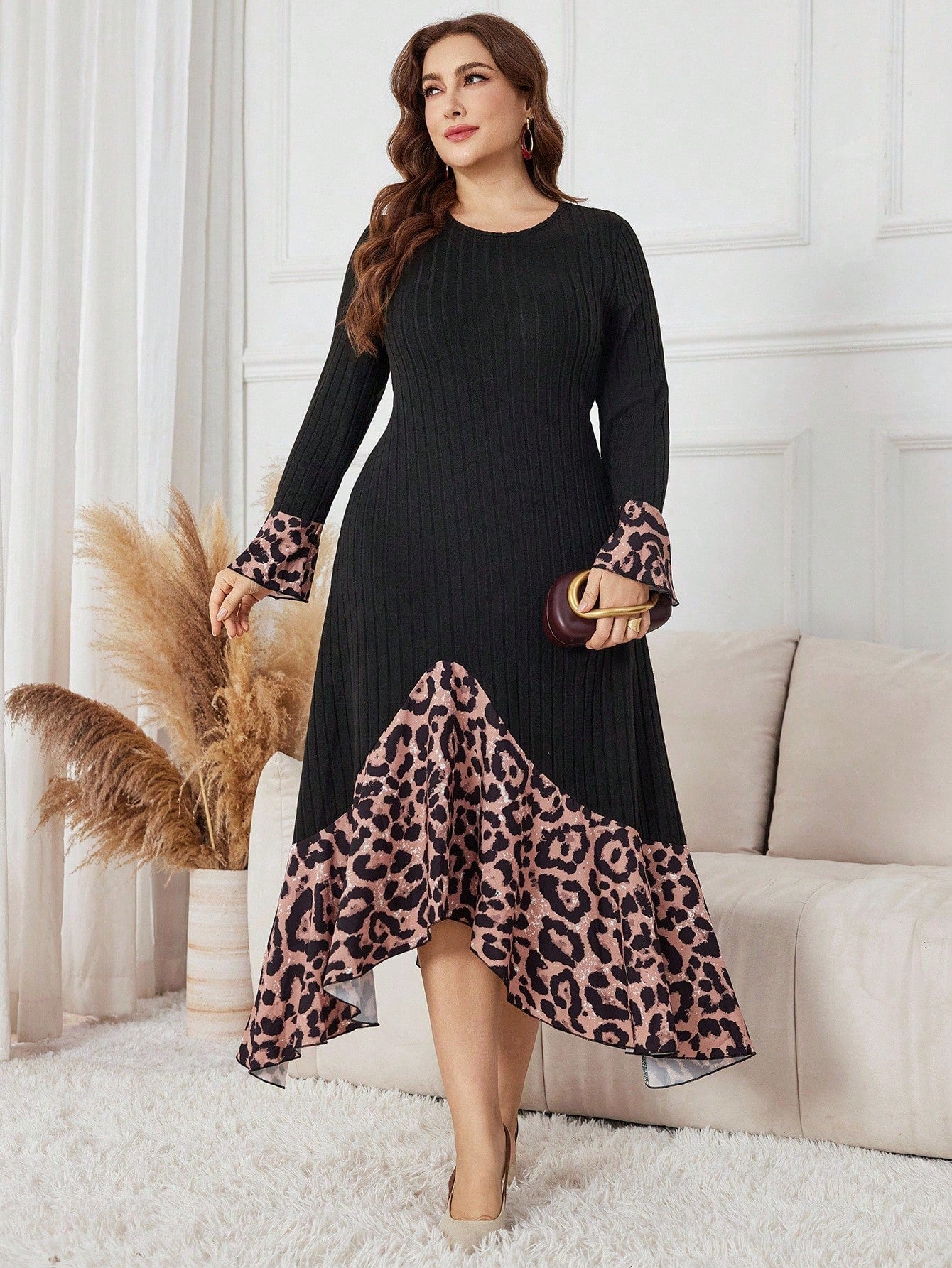 Turn heads in this playful plus size dress featuring a bold leopard print and an eye-catching asymmetrical hem. Crafted with a soft knitted and brushed patchwork design, it offers both comfort and style for any occasion. Flowy yet flattering, this dress lets you embrace your wild side with ease and confidence.
