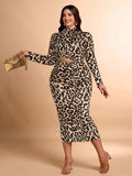 Make a statement in this stunning leopard print dress that celebrates your curves with flair. The bold animal pattern pairs perfectly with a chic stand collar and daring cutout waist detail, creating an effortlessly sophisticated silhouette. Designed for the modern plus-size woman who refuses to compromise on style, this piece transitions seamlessly from day to night. Whether you're heading to brunch or a special occasion, you'll turn heads in this playful yet polished look that proves fashion has no size l