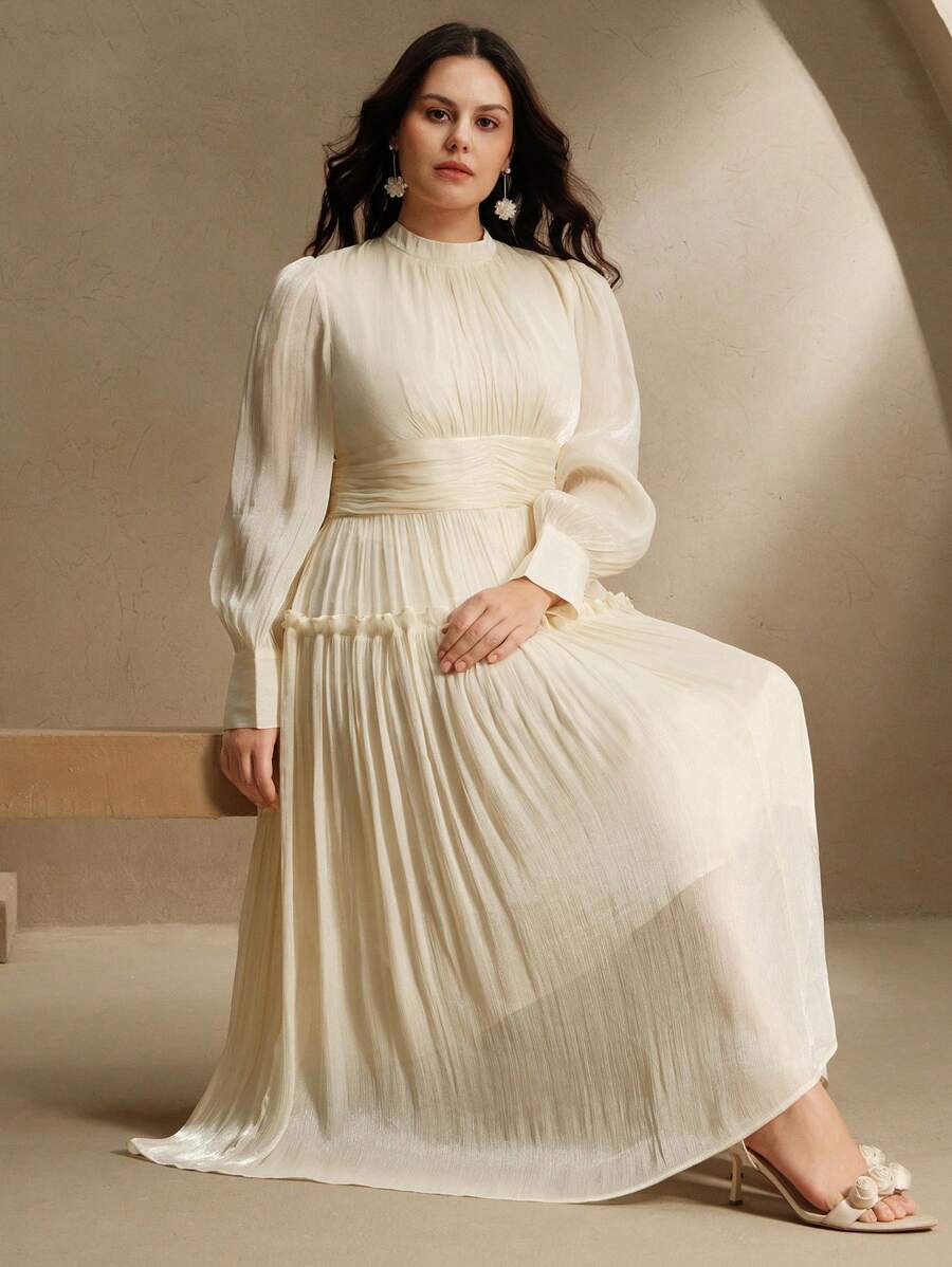 Step into elegance with this chic plus size long sleeve formal dress, designed to flatter every curve. The ruched waist adds a touch of sophistication while enhancing your silhouette, and the playful puff sleeves bring a fun, fashionable twist. Perfect for any special occasion, this dress combines comfort and style effortlessly, making you feel confident and fabulous all night long.