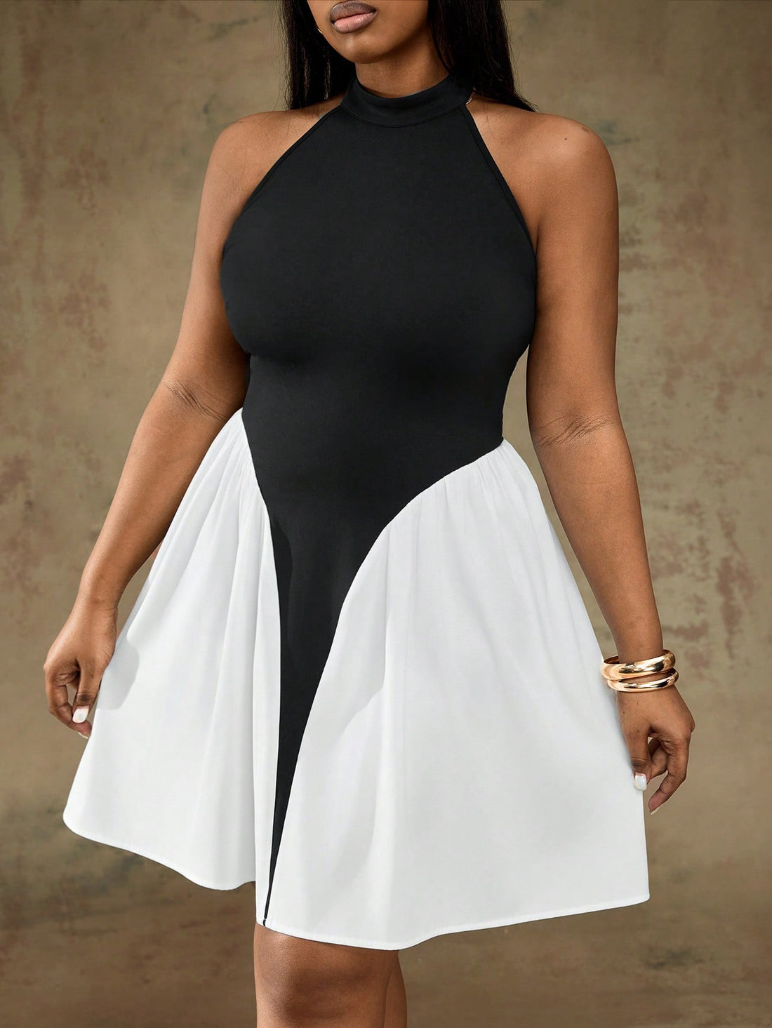 Make a statement in this stunning plus-size dress that effortlessly blends bold style with flattering silhouettes. The off-shoulder neckline adds a touch of elegance, while the black and white patchwork design keeps things visually exciting. An A-line cut skims your curves beautifully, and the playful ruffle waist detail brings movement and personality to every step. Perfect for date nights, parties, or any occasion where you want to feel confident and fabulous. Dress up with heels or keep it casual—this ve