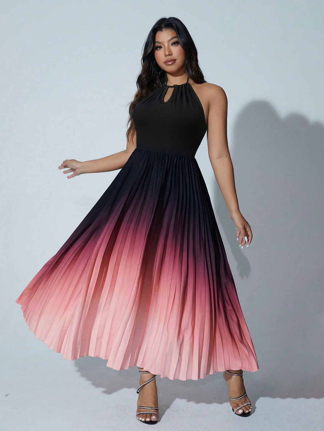 Turn heads with this Chic Plus Size Ombre Halter Neck Pleated Dress, perfect for making a stylish statement at any elegant event. The flattering halter neckline and flowing pleats create a graceful silhouette, while the ombre effect adds a fun splash of color that dances with every step. Celebrate your curves and embrace your playful side in this effortlessly stunning dress!