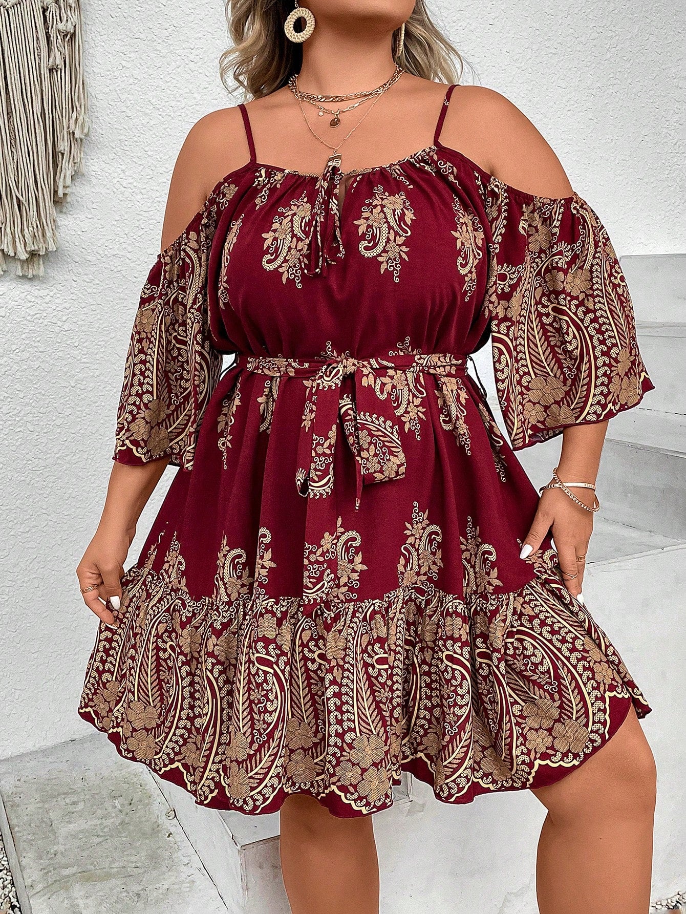 The Chic Plus Size Paisley Print Cold Shoulder Belted Dress is the perfect addition to your wardrobe. With its stylish paisley print and trendy cold shoulder design, this dress is versatile enough for any occasion. The included belt cinches your waist, creating a flattering silhouette. Make a statement and feel confident in this dress!