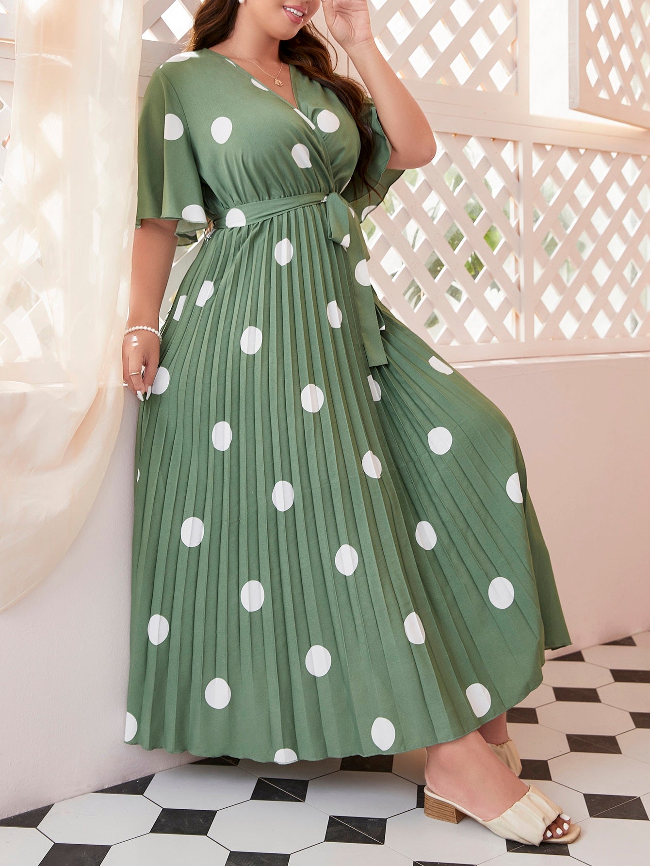 Embrace summer with this playful polka dot dress designed for plus size comfort! The butterfly sleeves add a flirty touch while the pleated design creates a flattering silhouette. The included belt cinches your waist for that perfect hourglass shape. Slip into effortless style for picnics, brunches, or casual outings - this dress does all the fashion work for you!