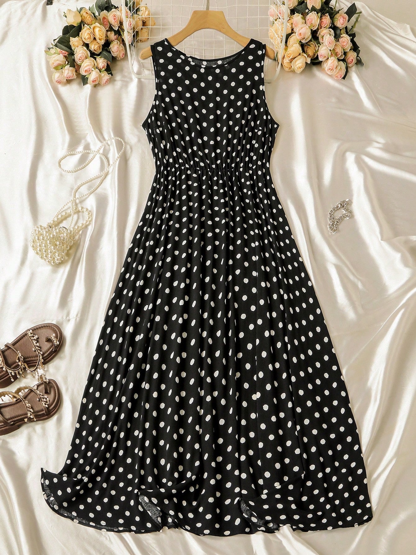 Step into summer with this playful plus size maxi dress featuring a classic polka dot pattern. The flattering V-neck and sleeveless design keep you cool, while the cinched waist adds a fun, flirty shape. Perfect for sunny days and warm evenings, this dress combines comfort and style effortlessly.