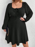 This effortlessly stylish plus size dress features a ribbed texture, a knotted front, and lantern sleeves. Perfect for any occasion, it's chic, comfy, and easy to wear. You'll look good and feel good in this dress, making it a must-have for your wardrobe.
