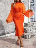 This elegant plus size dress features ruched detailing and a striking fish tail silhouette that flatters curves. The chic bell sleeves add a touch of sophistication to any occasion. Made for comfort and style, this dress is perfect for any formal event.