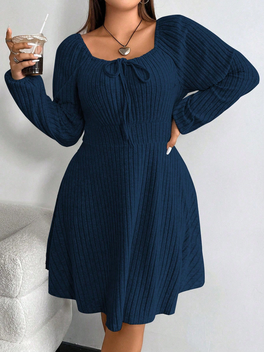 Get ready to turn heads with our Chic Plus Size Solid Color Midi Dress! Featuring a front tie and raglan sleeves, this dress is the perfect addition to your autumn and winter wardrobe. Stay stylish and comfortable with this must-have piece.