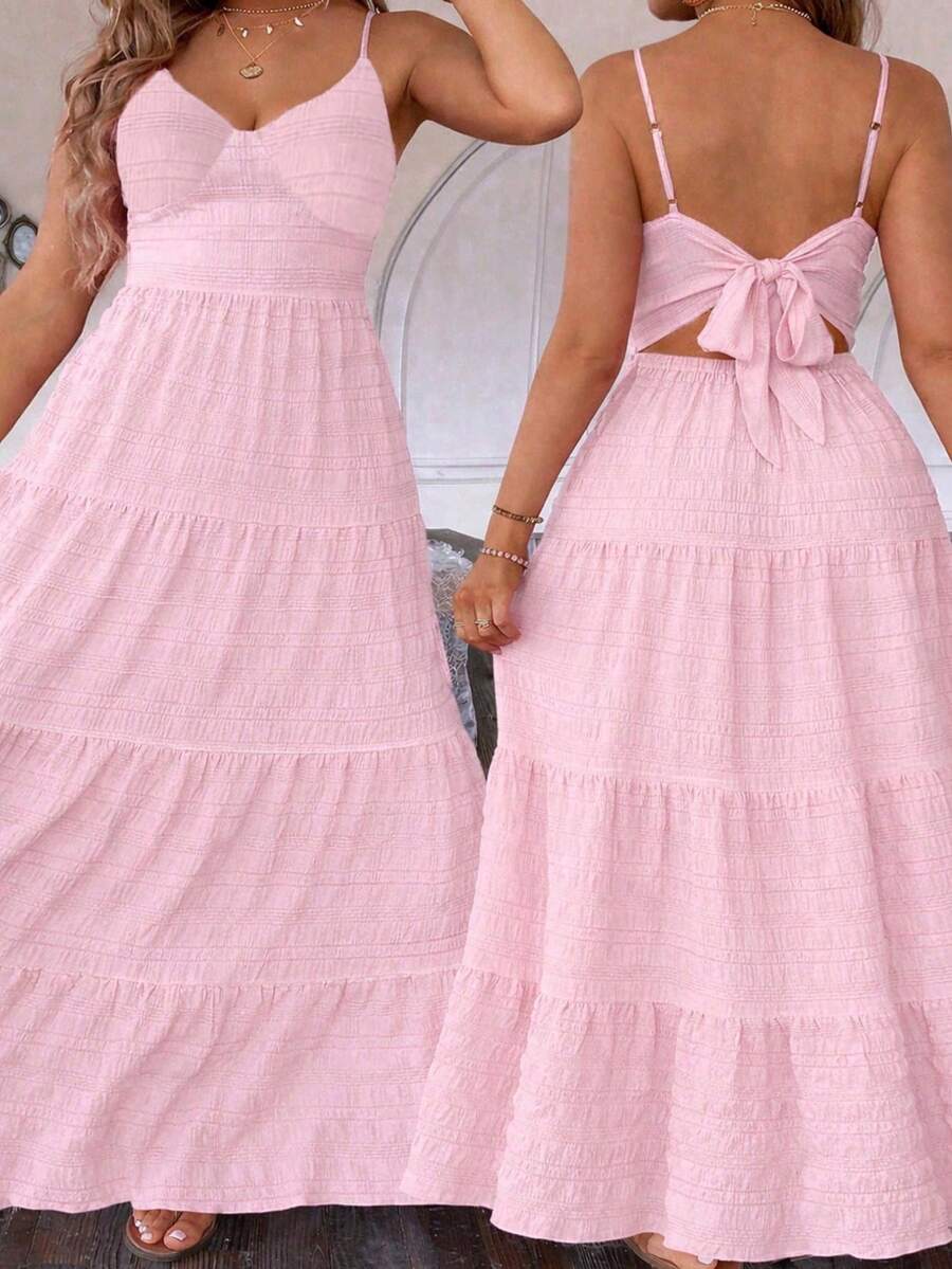  Elevate your summer wardrobe with this sophisticated plus-size maxi cami dress. Crafted for confident style, the relaxed cami neckline and flowing silhouette create an effortlessly chic look that celebrates your shape. The signature ruffled hem adds movement and dimension, perfect for everything from beach days to evening strolls.