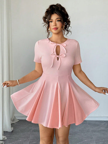 Elevate your wardrobe with this show-stopping plus-size mini dress that's equal parts bold and beautiful. The tie-front detail creates a flattering silhouette while the hollow-out waist adds an edgy, modern twist. Patchwork panels bring visual interest and dimension to every angle. Whether you're heading out for brunch, a night on the town, or anything in between, this versatile piece delivers confidence and style. Comfortable enough for all-day wear, striking enough to turn heads—because who says you can't