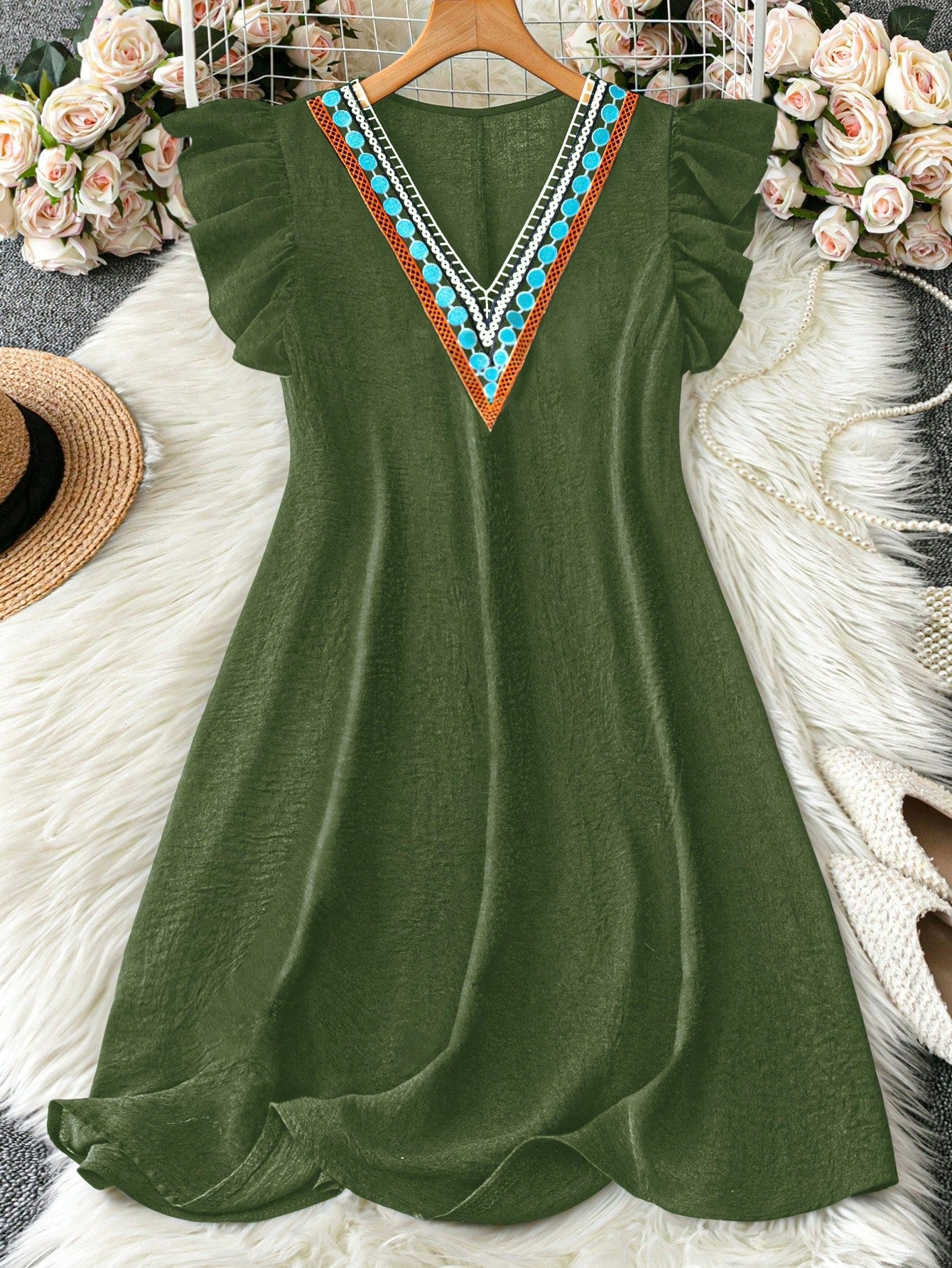 Step into vacation mode with this chic plus size V-neck floral A-line dress. Its flattering silhouette and vibrant floral pattern make it perfect for sunny days and breezy evenings. Comfortable and stylish, it effortlessly elevates your getaway wardrobe with a playful touch.