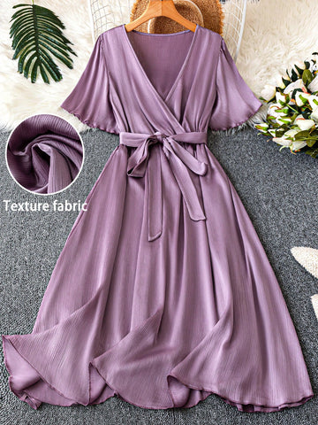 Step out in style with this Chic Plus Size V-Neck Tie Front Dress, designed to flatter your curves and add a playful touch to any elegant occasion. The short sleeves and tie-front detail create a fun, flirty silhouette while keeping comfort front and center. Perfect for turning heads and feeling fabulous all day or night.