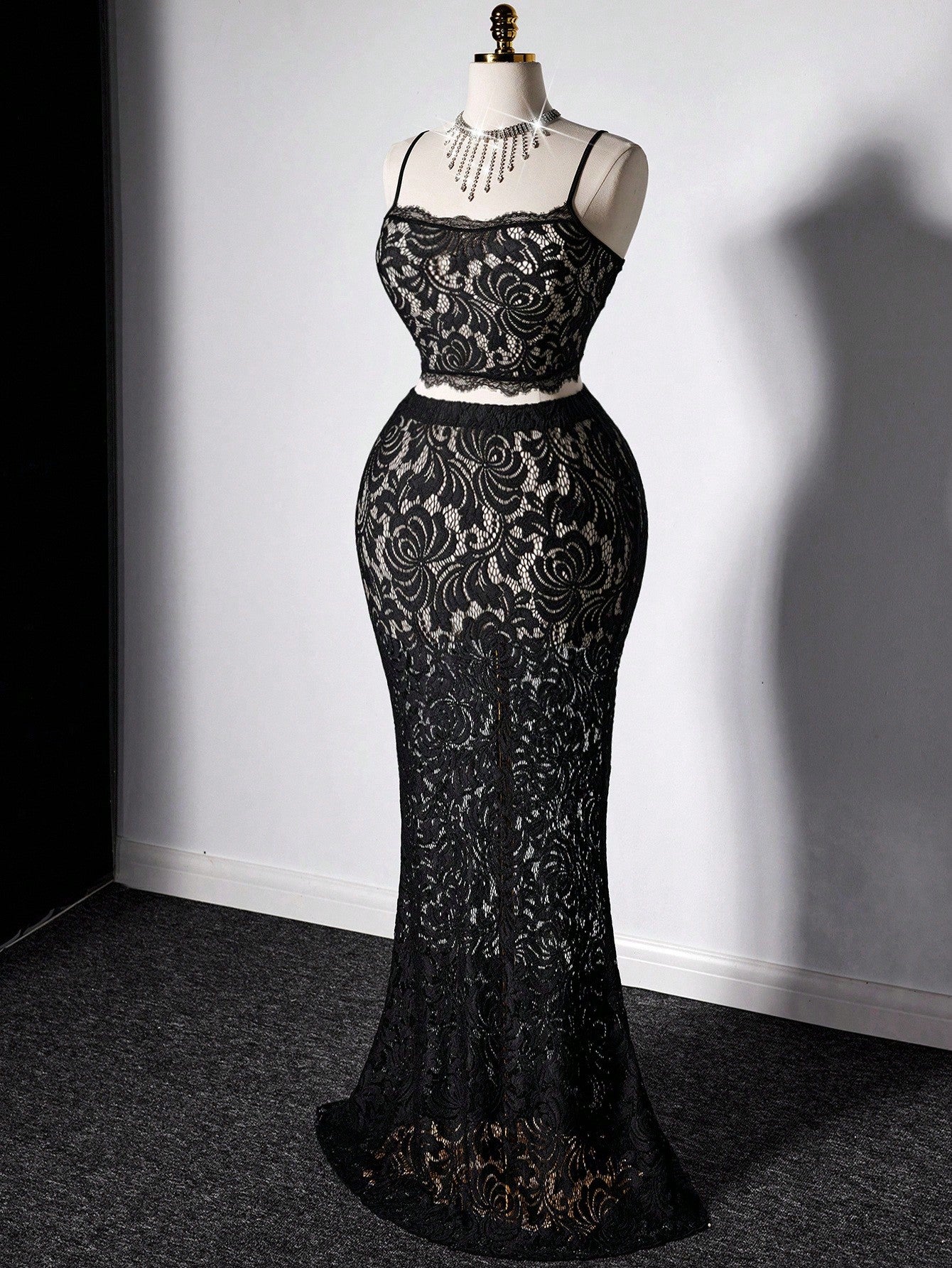 Elevate your summer wardrobe with this fabulous two-piece set designed for confident curves! The delicate sheer lace camisole features a cropped silhouette that flatters your figure, while the flowing fishtail skirt adds dramatic flair and movement. Perfect for date nights, beach getaways, or any occasion where you want to turn heads. This playful ensemble combines elegance with modern edge—because style has no size limit. Slip into sophistication and let your personality shine!