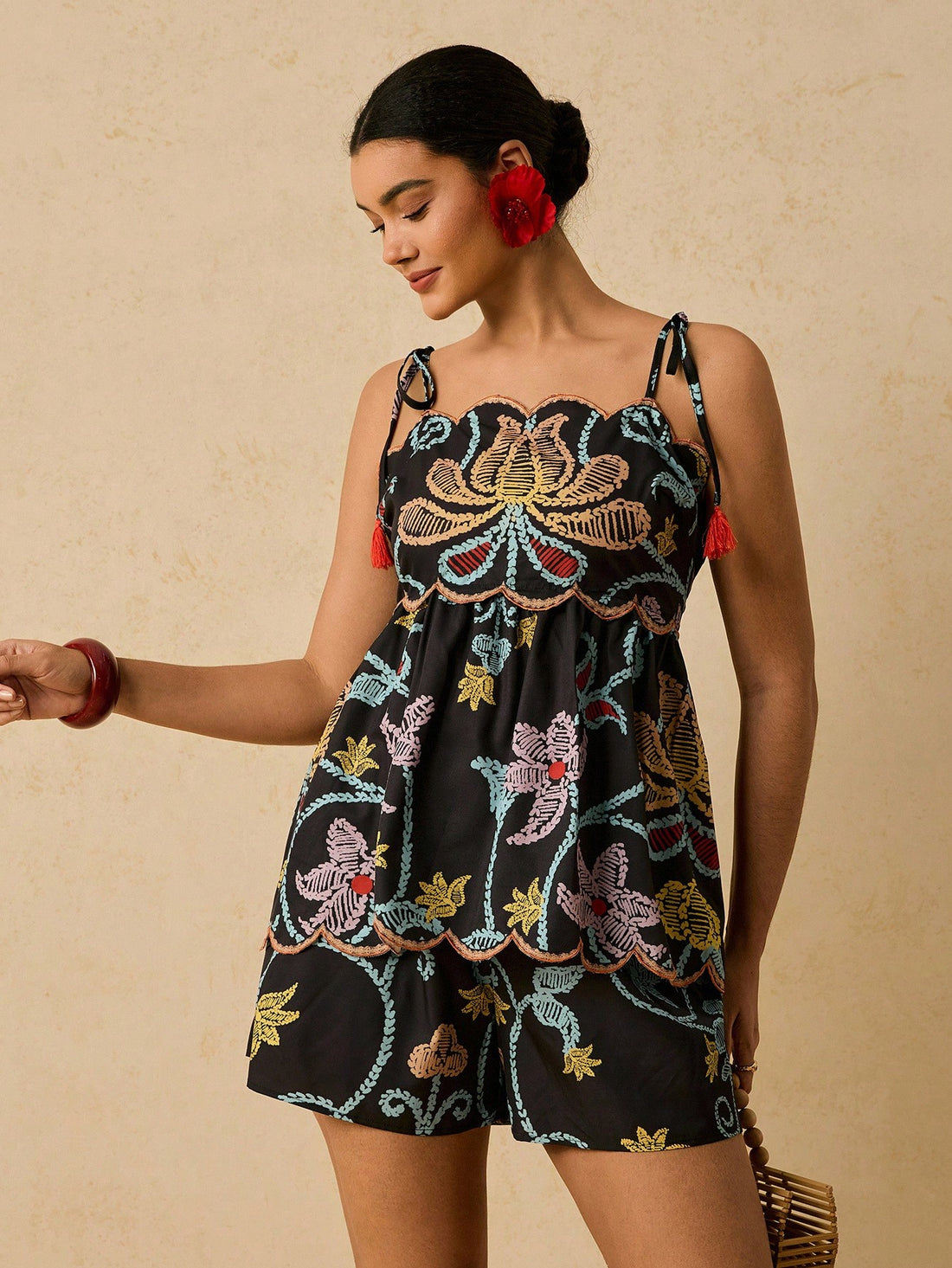 Elevate your seasonal wardrobe with this fabulous two-piece set designed for confident curves! The asymmetric ruffle camisole adds a flirty, fashion-forward touch, while the coordinating shorts offer comfort and style. Perfect for warm weather adventures, casual outings, or relaxed evenings at home. This playful pairing celebrates your unique style with modern flair and effortless charm. Mix, match, or wear together—either way, you'll feel amazing!