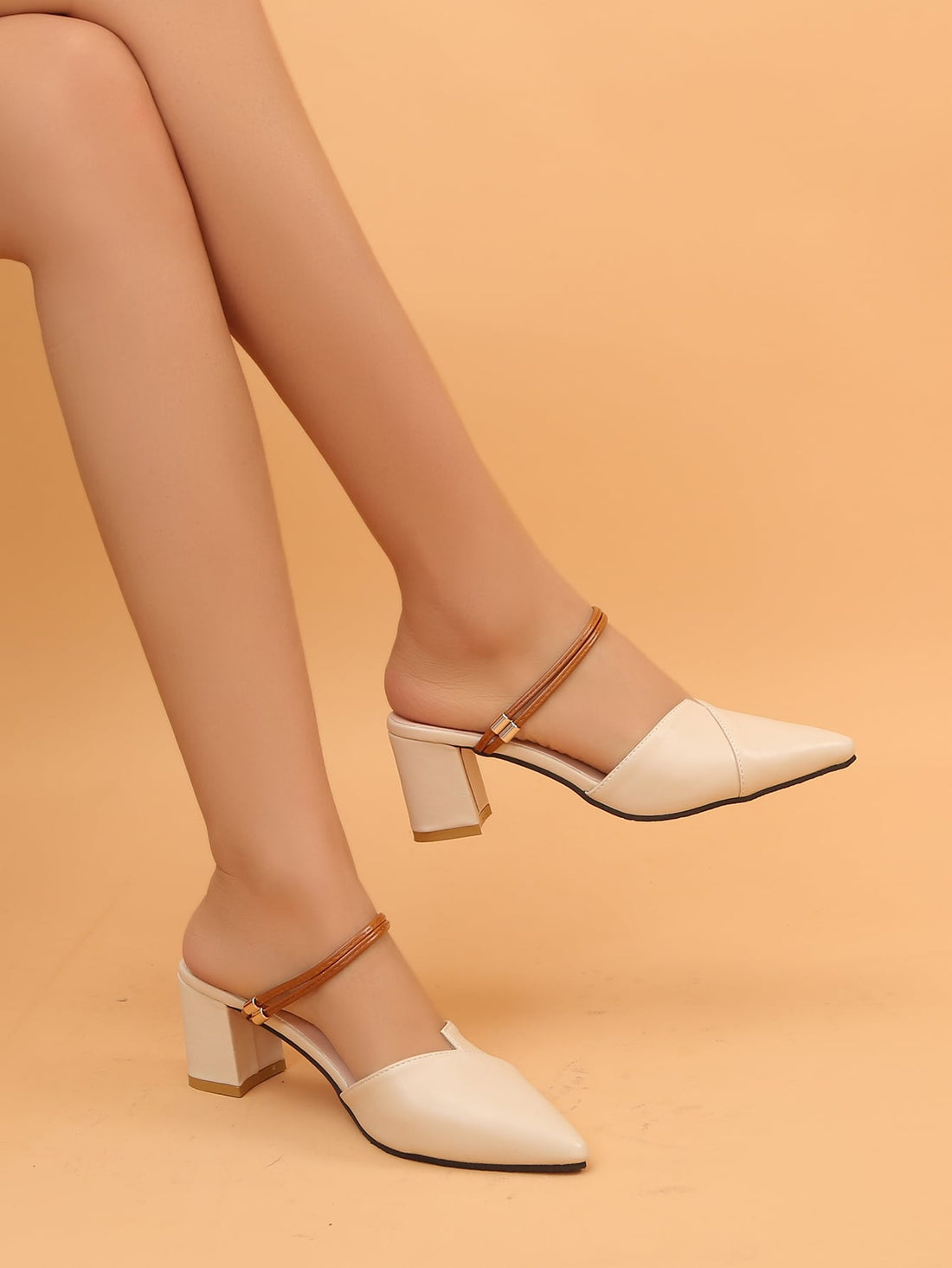 Step out in style with these chic pointed-toe high heel mules, perfect for adding a playful touch to your spring and summer looks. Their sleek silhouette elongates your legs, while the comfortable heel height lets you dance from day to night without missing a beat. Effortlessly stylish, these mules pair beautifully with everything from breezy dresses to cropped jeans.