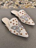 Slip into playful style with these Chic Pointed Toe Flat Mules! The adorable animal rhinestone accents add a touch of whimsy to your wardrobe, while the pointed toe design keeps your look stylish. Perfect for a casual day out, these flats will keep you comfortably chic.