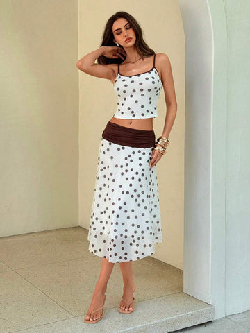 Elevate your summer wardrobe with this charming polka dot 2-piece set. The coordinated top and long skirt combination offers effortless elegance for any occasion—from casual outings to garden parties. The classic polka dot pattern adds a timeless touch, while the flowing skirt provides comfort and movement. Perfect for creating a put-together look without the fuss. Pair with your favorite accessories for a complete ensemble.