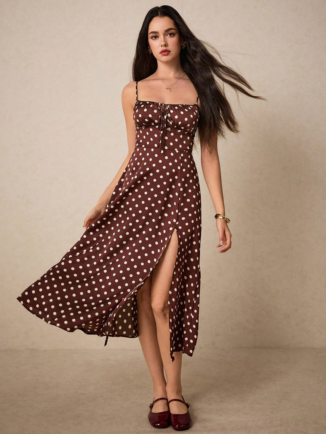 Add some fun to your wardrobe with our Chic Polka Dot Cami Dress! Featuring a playful knot front and flirty thigh split, this dress will make you stand out in any crowd. Perfect for a night out or a casual day, this dress is a quirky and stylish addition to any collection.