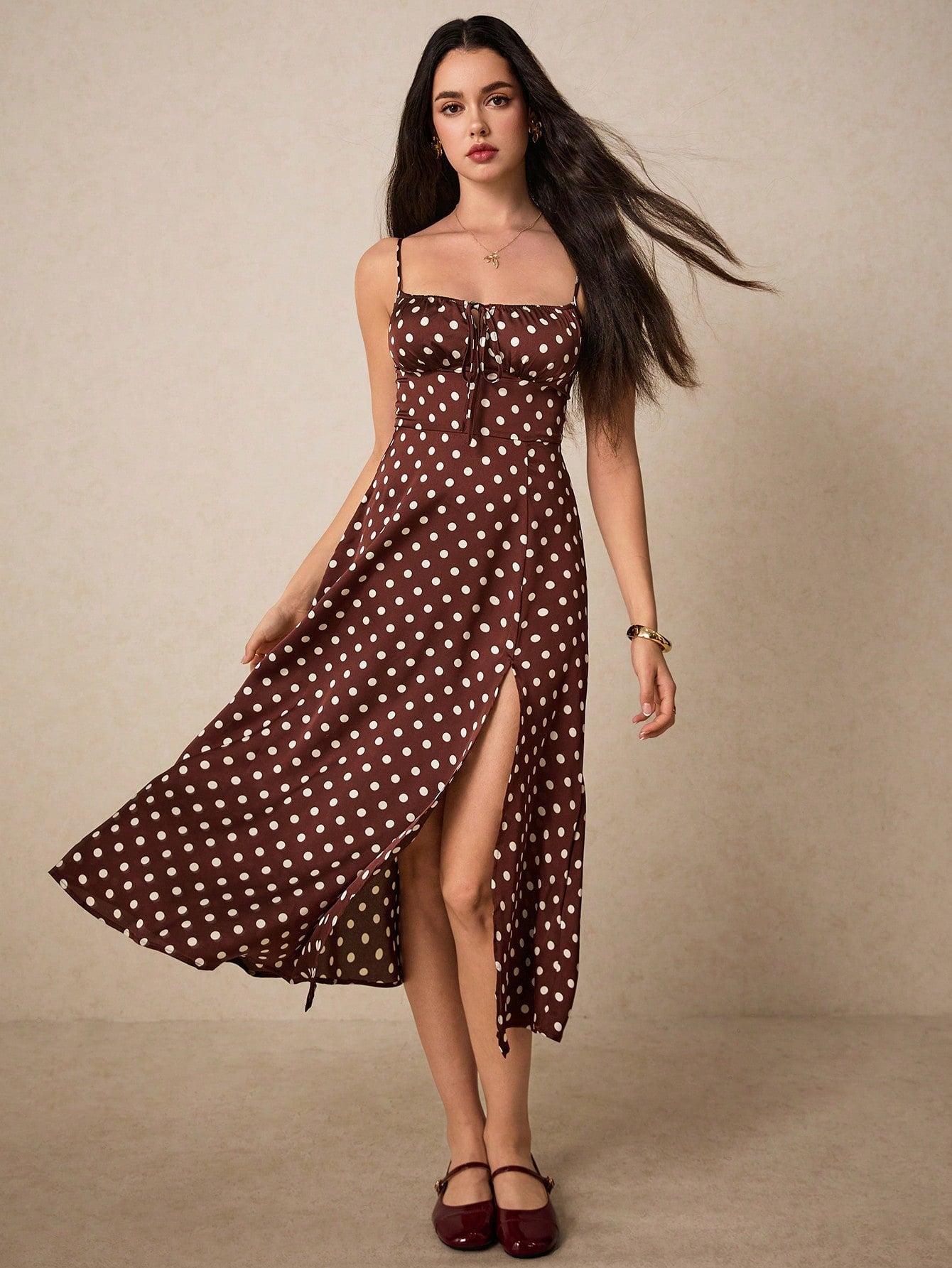 Add some fun to your wardrobe with our Chic Polka Dot Cami Dress! Featuring a playful knot front and flirty thigh split, this dress will make you stand out in any crowd. Perfect for a night out or a casual day, this dress is a quirky and stylish addition to any collection.