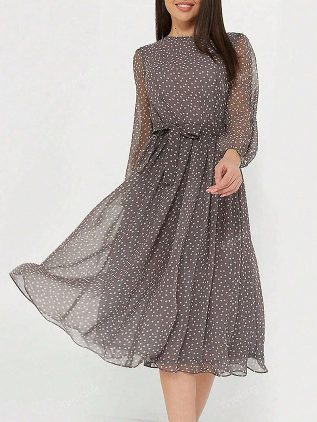 Effortlessly elevate your style with our Chic Polka Dot Lantern Sleeve Belted Flowy Dress. This elegant dress features a playful polka dot print and flowy silhouette, adorned with lantern sleeves and a flattering belted waist. Perfect for any occasion, this dress exudes effortless elegance and timeless charm.