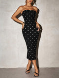 Cropped front view of black white polka dot strapless midi dress