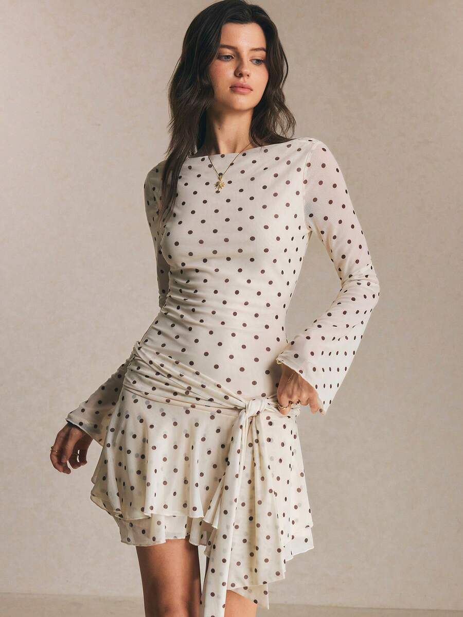 Elevate your summer wardrobe with this charming polka dot ruffle hem dress. The playful dot pattern brings timeless elegance, while the delicate ruffle detailing at the hem adds a touch of feminine flair. Perfect for casual outings, garden parties, or weekend brunches, this versatile piece transitions effortlessly from day to night. The relaxed fit ensures comfort without compromising style, making it an essential addition to any woman's closet.