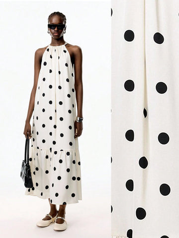 Turn heads on your getaway with this playful polka dot halter maxi dress. Its ruffled hem adds a flirty touch, while the breezy silhouette keeps you comfortable from beach strolls to sunset dinners. Effortless style meets vacation-ready charm in one chic dress.