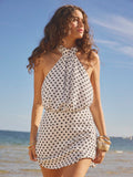Step into summer with this playful polka dot mini dress designed to turn heads at celebrations and graduations. Its sleeveless cut keeps you cool, while the fun dot pattern adds a lively touch to your party look. Perfect for dancing the day away or capturing joyful moments, this dress blends comfort with cheerful style effortlessly.
