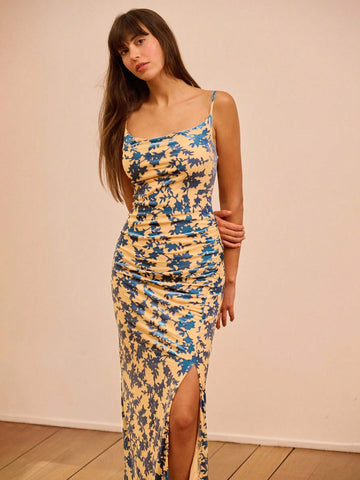 Elevate your autumn wardrobe with this stunning printed maxi dress that's equal parts sophisticated and fun. The graceful cowl neckline drapes beautifully while ruched side detailing cinches your silhouette for a flattering fit. A cheeky side slit keeps things interesting as you move, adding just the right amount of flair to your everyday elegance. Perfect for transitioning from brunch to evening plans, this dress proves that timeless style doesn't have to be boring.