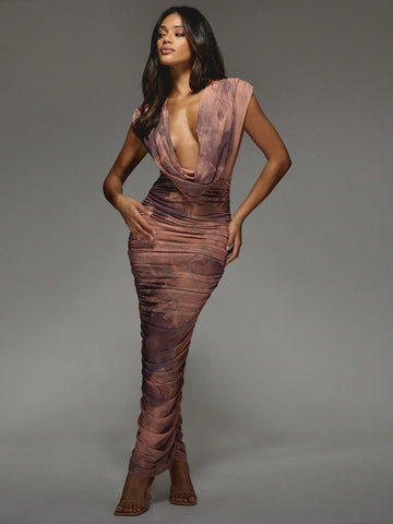 Unleash your inner fashionista with this chic and playful dress. The alluring deep plunge and ruched design add a touch of allure, while the printed mesh and cowl neck add a trendy twist. Perfect for a night out or special event, this maxi dress will turn heads and make you stand out. (Fashionable and bold, with a touch of allure and trendiness - this dress has it all!)