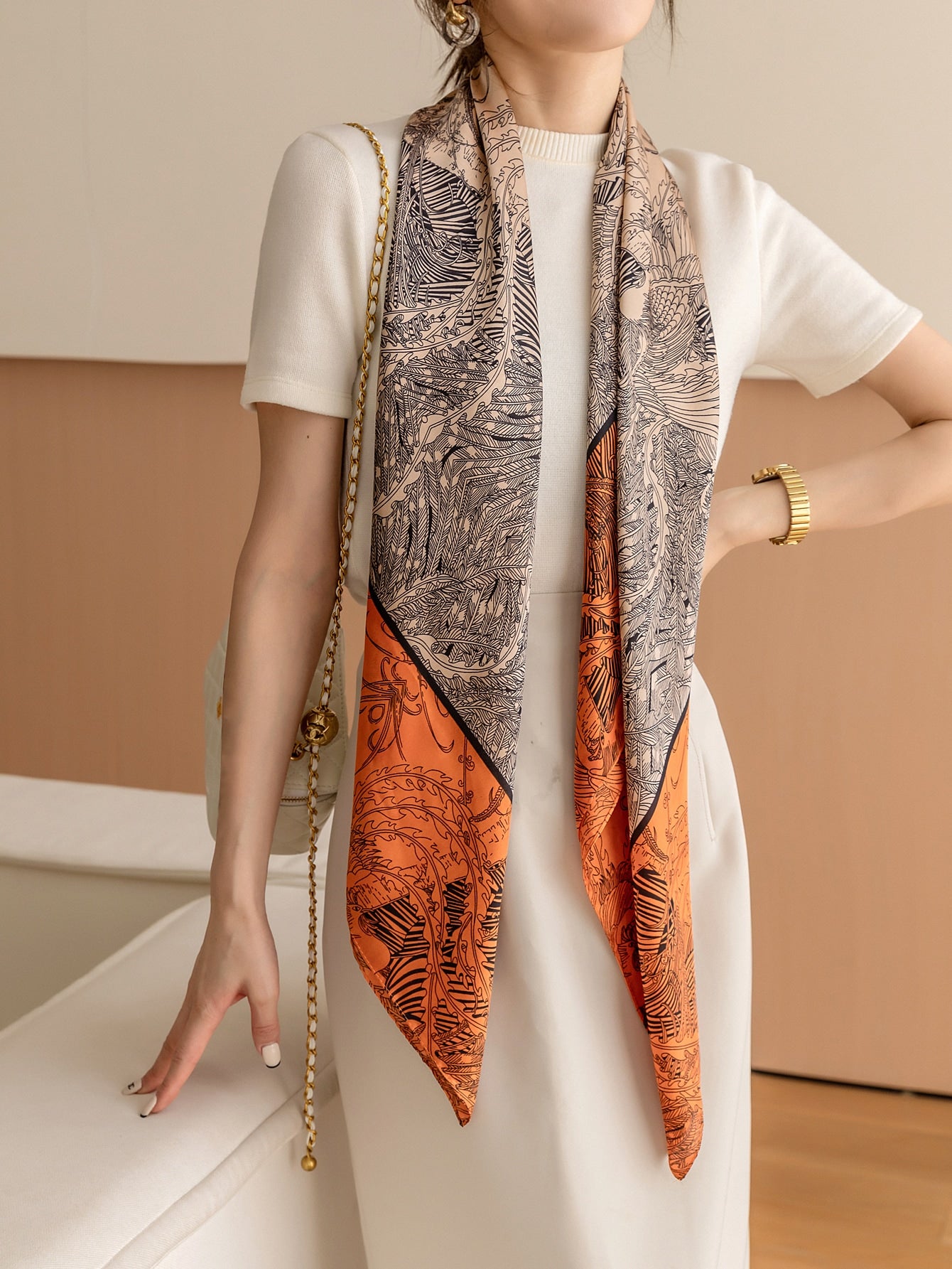 Elevate your style with this versatile Chic Printed Silk Square Scarf. Made from premium silk, it adds a touch of sophistication to any outfit. Whether you wear it as a bandana, neck scarf, or head wrap, you'll exude confidence and elegance. Transition seamlessly from day to night with this must-have accessory.