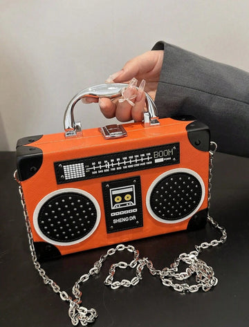 Turn heads with this Chic Purple Radio-Shaped Handbag, a playful nod to music lovers everywhere. Its unique gift box style blends retro charm with modern flair, making it the perfect statement piece for any outfit. Carry your essentials in style while showing off your love for all things musical!