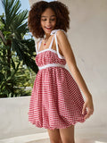 Step into sunshine with this playful red and white checkered mini dress, designed to brighten your spring and summer getaways. Featuring a charming bow knot detail, it adds a flirty touch to your vacation wardrobe. Lightweight and breezy, this dress keeps you comfortable while turning heads wherever you go. Perfect for picnics, beach strolls, or casual outings, it’s your go-to for effortless, fun style.