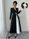Unleash your inner fashionista with this Chic Retro Elegance maxi dress! Featuring a unique black and white patchwork design, this dress is perfect for making a statement. The playful bubble sleeves add a touch of whimsy to this elegant piece. Step out in style and turn heads with this must-have dress.